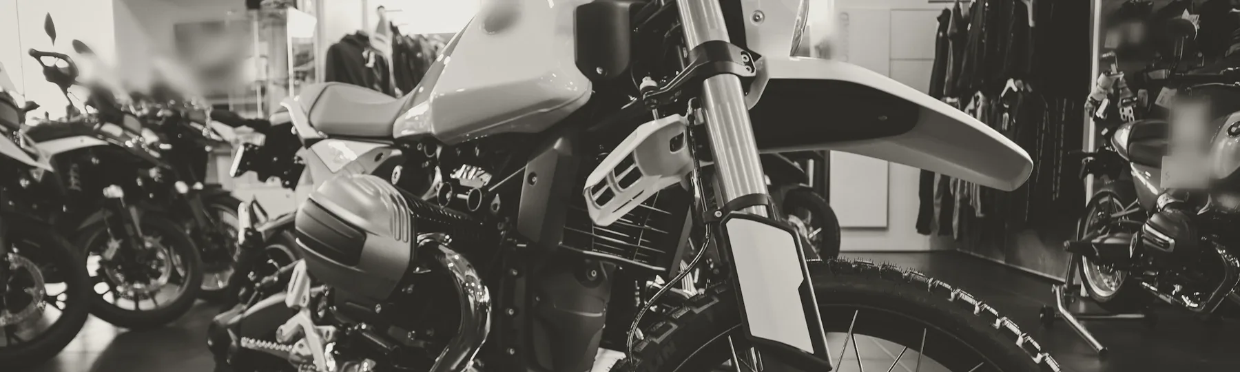 Motorcycles lined up on a showroom floor.